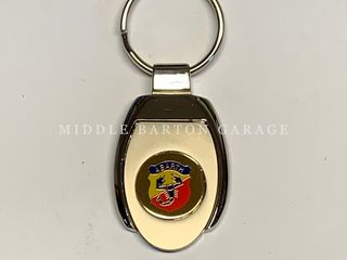 KEYRING - SILVER WITH GOLD ABARTH BADGE